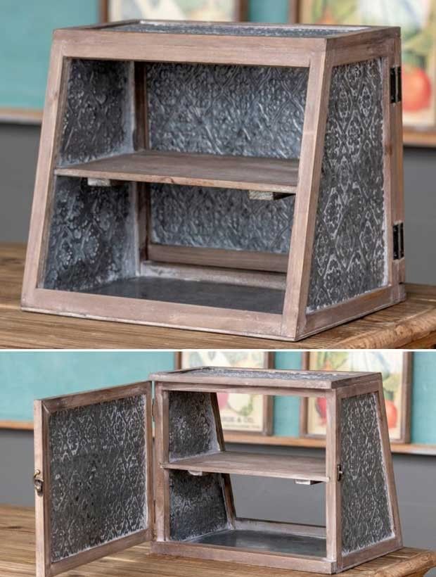 an old wooden shelf has been transformed into a decorative display case with glass inserts