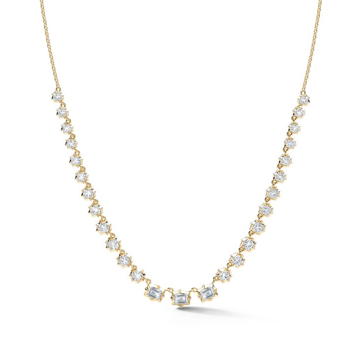 This tennis-style eternity necklace is the perfect hint of classic while firmly rooted in the present. The Vanguard Diamond Riviera Necklace combines the classic tennis silhouette with our signature Alchemy setting to bring forward a modern feel. Handcrafted in 18-karat gold and featuring 3 emerald-cut and 22 round, brilliant cut diamonds, the Vanguard Riviera Necklace is a show-stopping must-have for any jewelry collection. Combine this necklace with heavier chain pieces like the Pia and Phoebe Yellow Gold Brilliant Cut Tennis Necklace, Yellow Gold Tennis Necklace With Prong Setting, Timeless Yellow Gold Tennis Necklace With Prong Setting, Tennis Silhouette, Riviera Necklace, Eternity Necklace, Tennis Style, Bespoke Engagement Ring, Heavy Chain