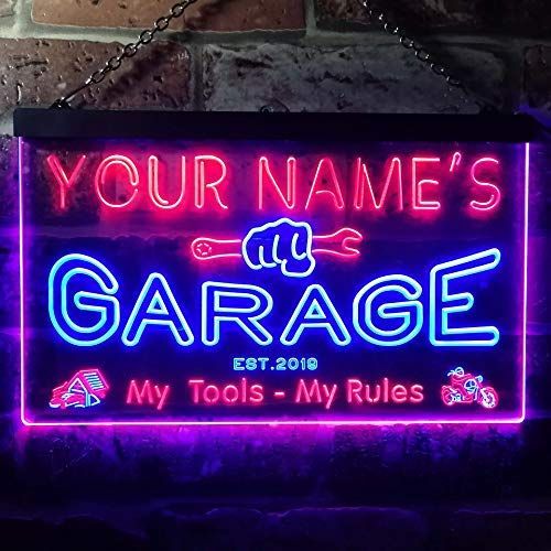 a neon sign that says, your name's garage with tools - my rules