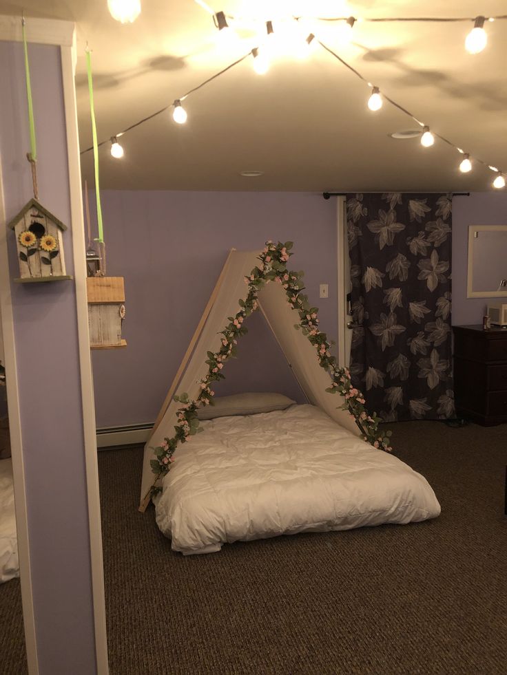 a bed with a white canopy in a room