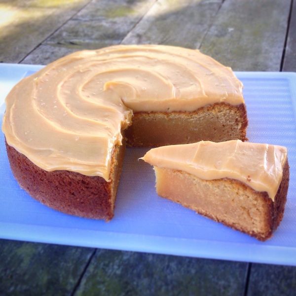 a cake that has been cut into pieces and is on a blue plate with one slice missing