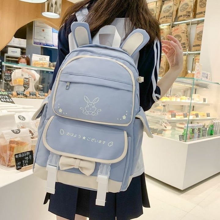 This Kawaii Colorful Bunny School Backpack is the perfect companion for stylish students who want to make a statement. Crafted from high-quality materials with playful bunny details and vibrant colors, this backpack adds a touch of sophistication to any outfit. It's the perfect blend of artistic flair mixed with practicality: a work of art you can carry to school, work, or the library. Kawaii Backpack With Cute Design For Students, Trendy Backpack With Cute Design For School, Trendy Backpack For School With Cute Design, Trendy School Backpack With Cute Design, Trendy Cute Design Backpack For School, Casual Travel Backpack With Cute Design, Casual Student Backpack With Cute Design, Large Capacity Cute Backpack For Students, Harajuku Style Student Backpack