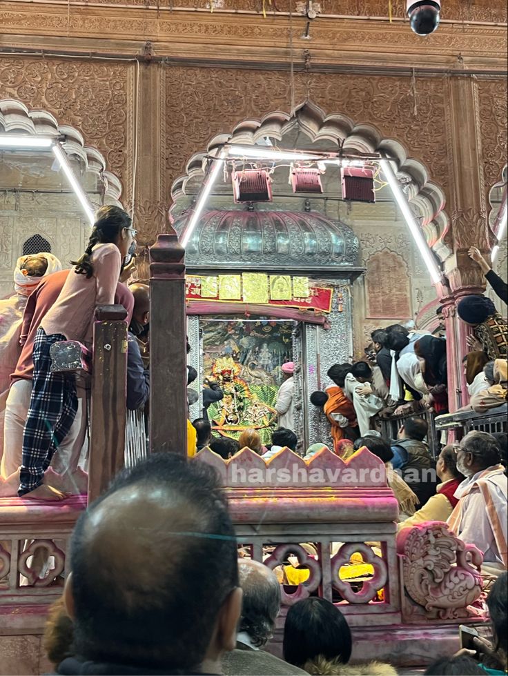 a group of people standing in front of a shrine