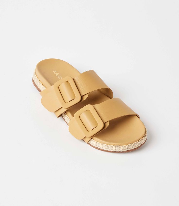 Crafted exclusively from genuine leather in the upper, lining, and innersole, these sandals are the epitome of luxury and quality craftsmanship. Featuring a timeless double band buckle design, these adjustable sandals offer both style and comfort for all-day wear. 100% Leather Imported Narrow width - True to size; for half sizes we recommend ordering a full-size up | Karen Kane Buckled Leather Sandals in Natural, Size 8, Plain Luxury Summer Footbed Sandals With Leather Sole, Leather Sandals With Tang Buckle For Beach, Summer Slides With Tang Buckle And Single Toe Strap, Luxury Summer Sandals With Rectangular Buckle, Leather Footbed Sandals With Tang Buckle For Beach, Summer Slides With Single Toe Strap And Tang Buckle, Leather Mules With Buckle Closure For Beach, Spring Slide Sandals With Tang Buckle, Luxury Sandals With Buckle Closure For Vacation