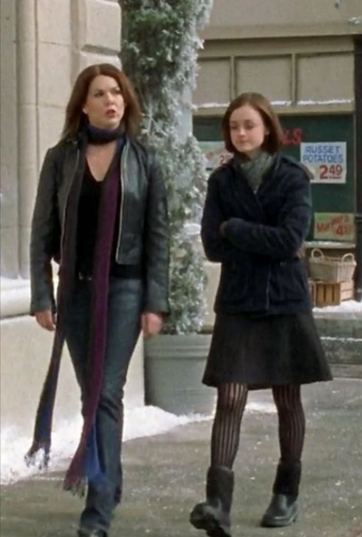 two women walking down the street in winter