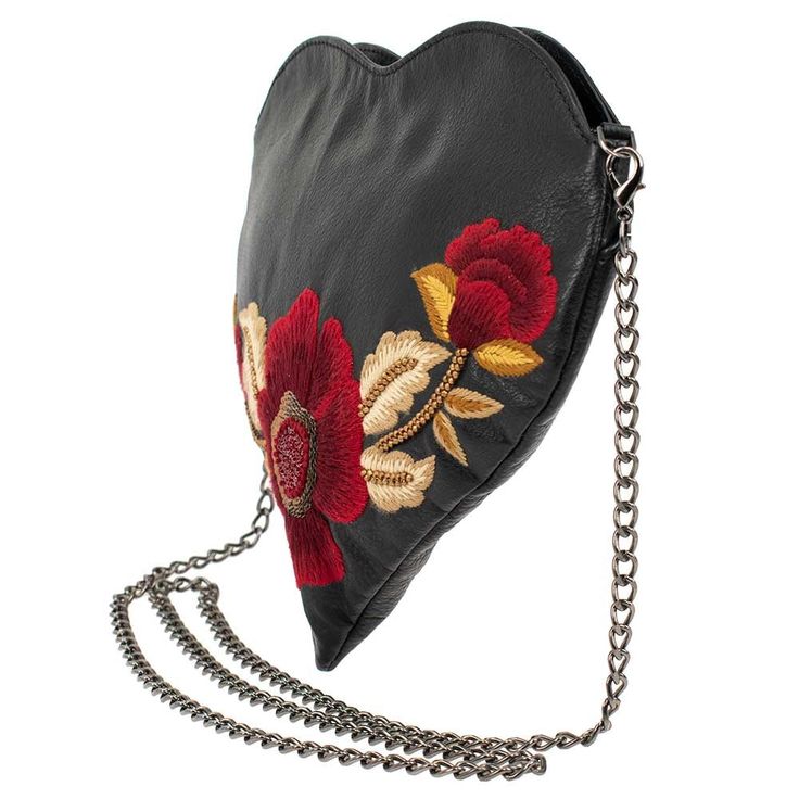 Make a statement in a Heartbeat! This sleek black leather crossbody heart-shaped handbag has a striking flower in rich, red embroidery, accented with gold leaves - adding a bold and romantic touch to the design. Perfect for everyday use or as a statement piece for a special occasionProduct Details 10" x 1" x 9" Strap Length End to End: 49" Strap Drop: 23" Removable crossbody chain strap, zipper closure, inside pocket, back pocket, fits a phone, metal logo fob, protective storage bag, certificate Chic Heart-shaped Leather Bag, Heart-shaped Leather Shoulder Bag, Valentine's Day Leather Shoulder Bag For Evening, Leather Shoulder Bag For Valentine's Day Evening, Leather Shoulder Bag For Evening And Valentine's Day, Heart-shaped Leather Shoulder Bag For Gift, Heart-shaped Leather Shoulder Bag Gift, Black Leather Heart-shaped Bag, Leather Shoulder Bag For Valentine's Day Gift