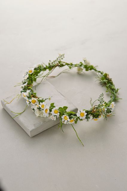 a white flower crown sitting on top of a table