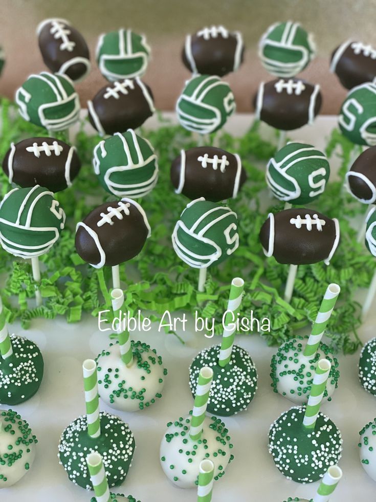 green and white cake pops with footballs on them