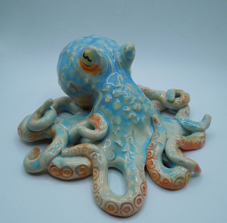 an octopus figurine sitting on top of a white table