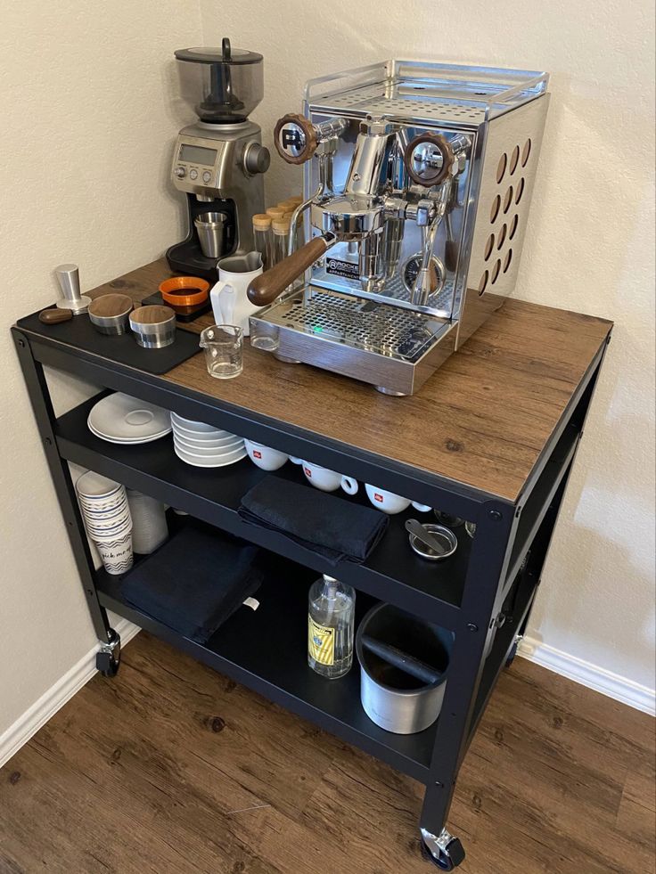 an espresso machine sitting on top of a wooden table