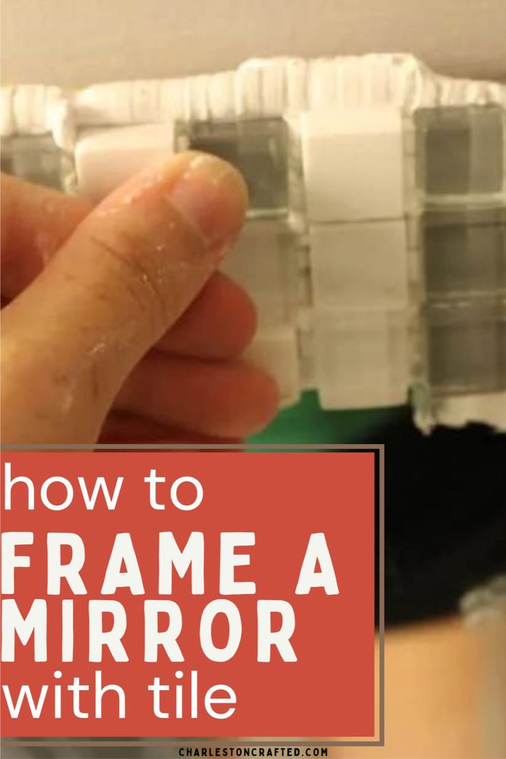 a hand is holding a mirror with the words how to frame a mirror with tile