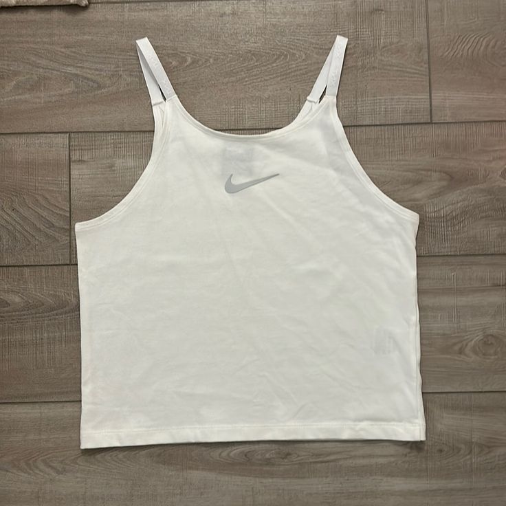 Nike White Tank! Never Worn Before. Size Large. Great Condition. Nike Crop Top For Spring, Nike White Tops For Summer, White Casual Nike Tank Top, Casual White Nike Tank Top, Nike Basic Summer Tops, Nike Casual Tank Top For Summer, Sports Attire, Nike Top, Tops Nike