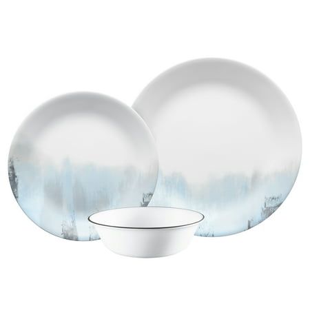 two white plates and a bowl on a white background