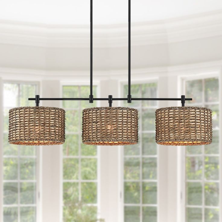 This farmhouse style linear island chandelier light features matte black hardware and 3 drum shades which are meticulously hand-woven of natural rattan/wicker, makes it a unique hanging pendant lights for above kitchen island and dining table or cafe bar. This collection can work with a variety of boho decors and even work in homes with coastal or farmhouse styling True Fine Villa 3-Light Matte Black Coastal Led Chandelier | TD10049C Flaming Arrow, Master Addition, Farmhouse Chandelier Lighting, Coastal Chandelier, Rattan Chandelier, Drum Pendant Lighting, Rattan Shades, Rattan Pendant Light, Farmhouse Chandelier