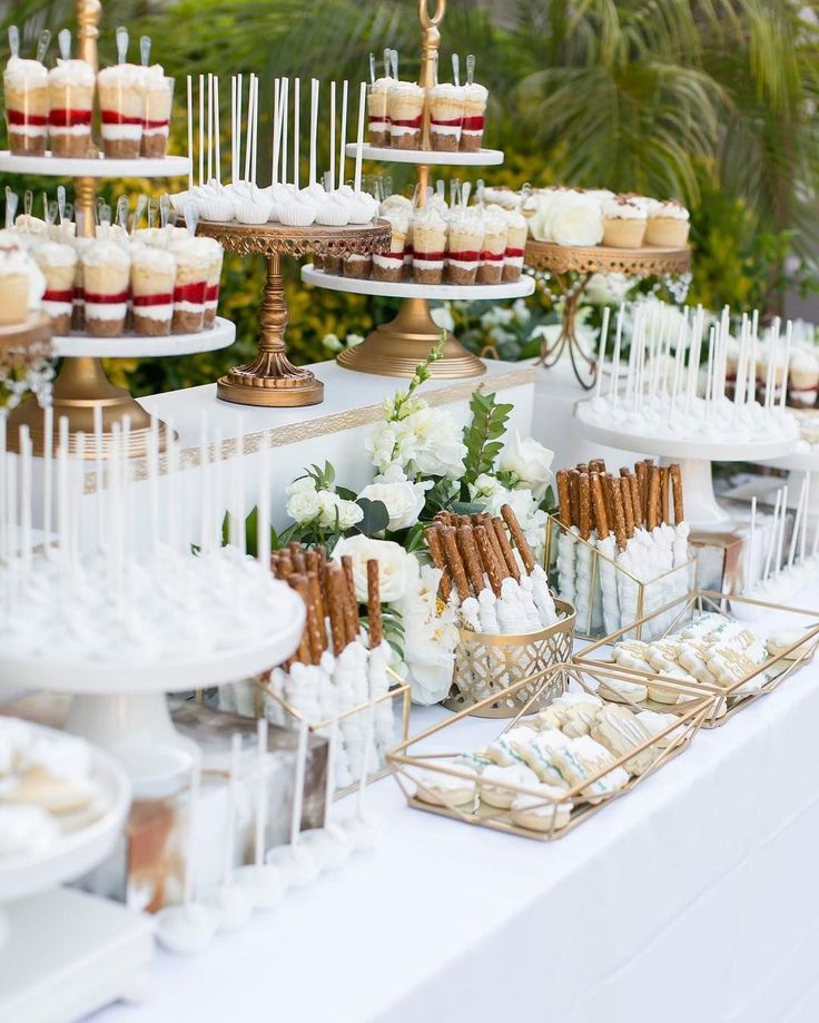 desserts and cupcakes are displayed on a table