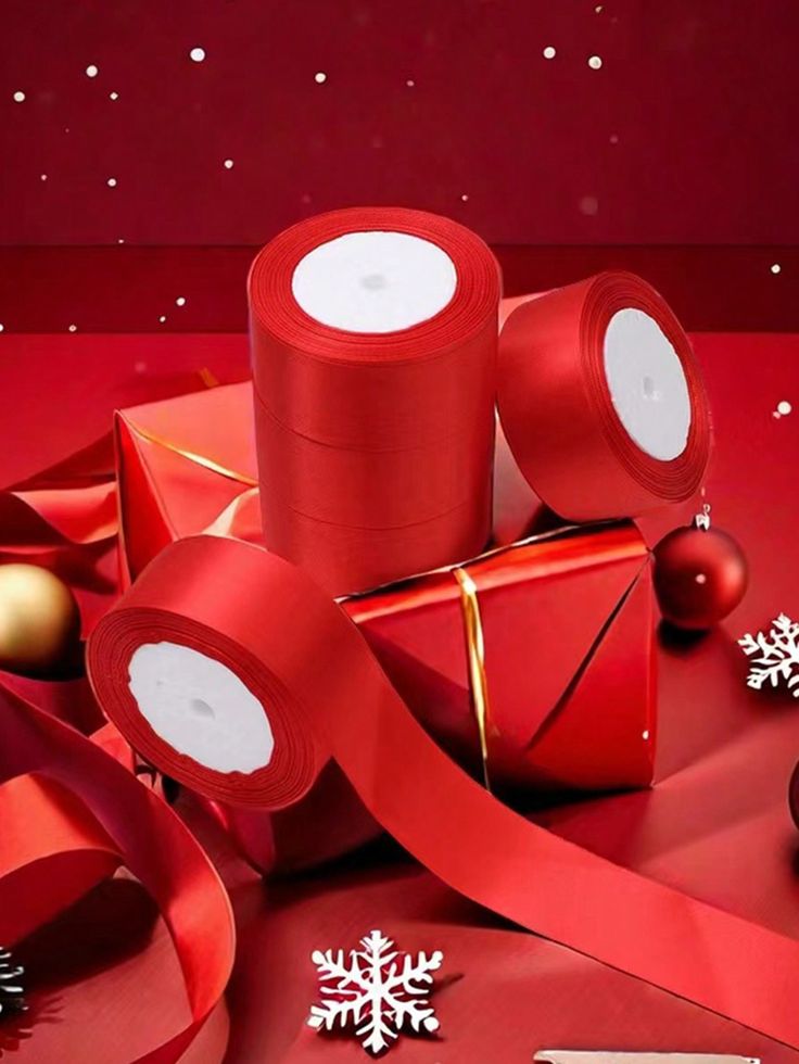 red wrapping tape and christmas decorations with snowflakes