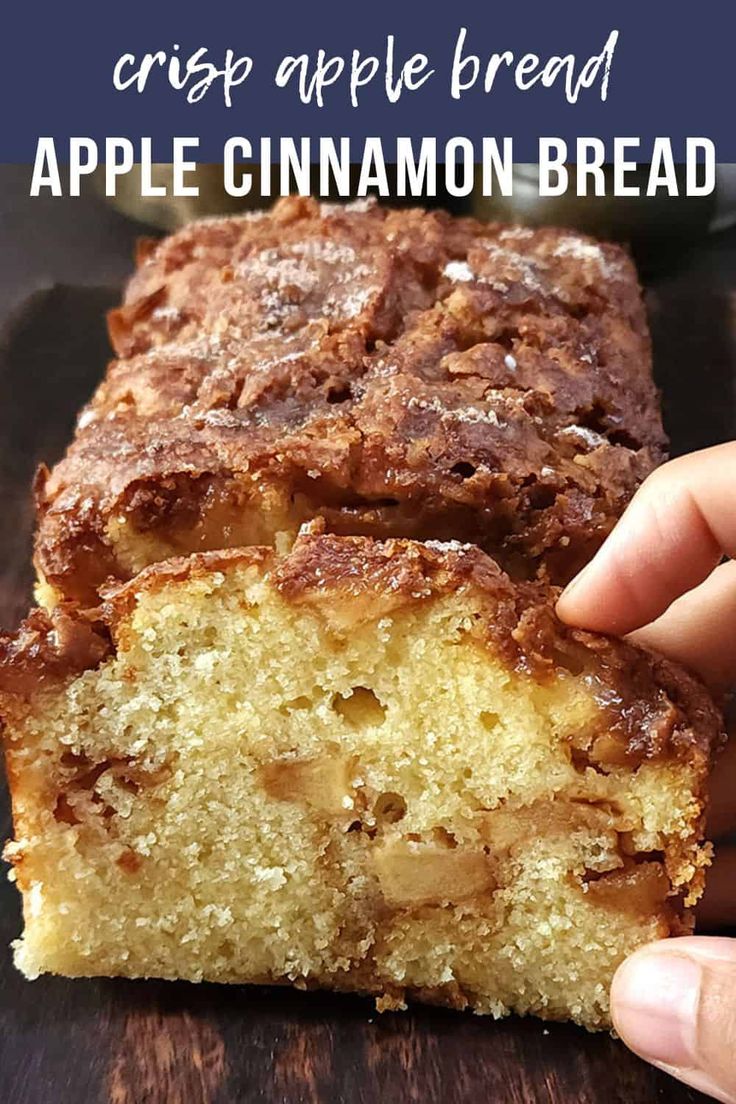 a hand holding a piece of apple cinnamon bread