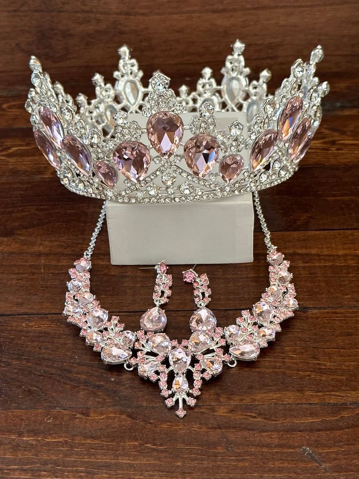 a tiara and necklace on a wooden table