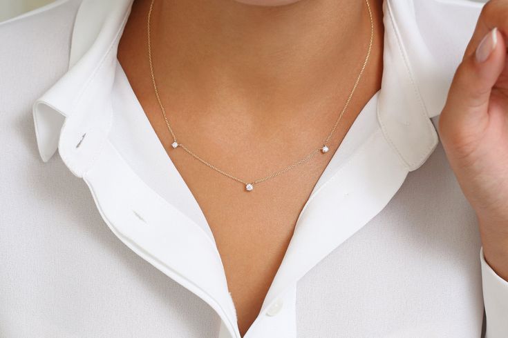 "Solitaire Necklace / 14k Gold Prong Setting 3 Station Diamond Necklace / Diamond Solitaire Necklace / Layering Necklace / Choker Necklace Features * Made to Order. * Gold Kt: 14K * Choice of Gold Color: Rose Gold, Yellow Gold, White Gold * Round Diamond: 1 pc 3.0 MM * Round Diamond: 2 pcs 2.7 MM * Total Number of Stones: 3 * Total CTW: 0.28 ctw * Diamond Color Clarity: G Color SI Clarity * Setting Type: Prong Setting * Ready to Ship in 7-10 Business Days If you have any additional questions abo Solitaire Necklace, Diamond Solitaire Necklace, Necklace Layering, Necklace Diamond, Solitaire Necklaces, Necklace Choker, Layering Necklace, Choker Necklaces, Mom Style