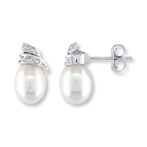 Lustrous baroque-shaped cultured pearls are crowned with swirls dotted with sparkling diamond accents in these lovely earrings for her. Fashioned in 14K white gold, the earrings secure with friction backs. Anniversary Pearl Bridal Earrings With Diamond Accents, Elegant Pear-shaped Pearl Earrings For Anniversary, White Pearl Earrings With Diamond Accents For Anniversary, Pearl Diamond Earrings For Anniversary, Evening Pearl Earrings In Diamond White, Diamond White Pearl Earrings For Evening, Elegant Pearl Earrings With Diamond Accents For Anniversary, White Gold Pear-shaped Pearl Earrings, Fine Jewelry Pearl Earrings With Diamond Accents For Evening