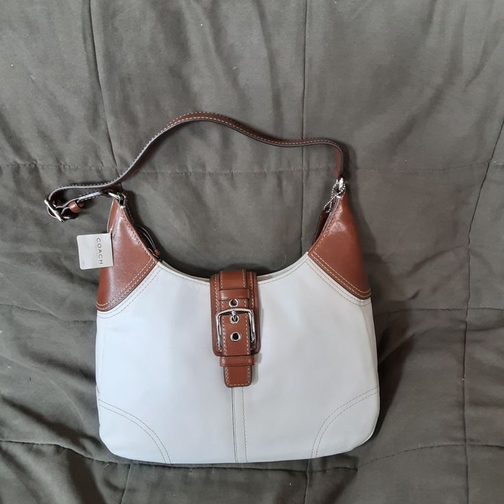 White With Brown Coach Large Hobo Bag. Zipper Closure. New! White Bags With Leather Handles For Formal Occasions, White Formal Bags With Leather Handles, Formal White Bags With Leather Handles, Coach Cream Hobo Shoulder Bag, White Shoulder Bag With Silver-tone Hardware And Double Handle, White Shoulder Bag With Silver-tone Hardware For Daily Use, White Double Handle Hobo Bag With Leather Handles, White Tote Shoulder Bag With Silver-tone Hardware, White Crossbody Hobo Bag With Leather Handles