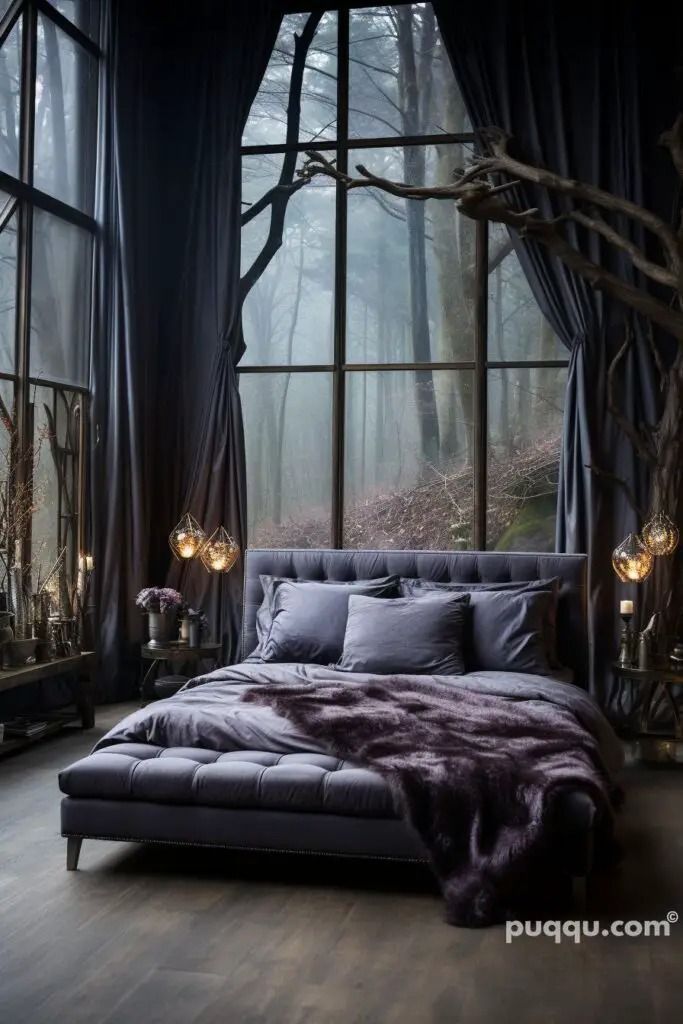 a bed sitting in front of a large window next to a forest filled with trees