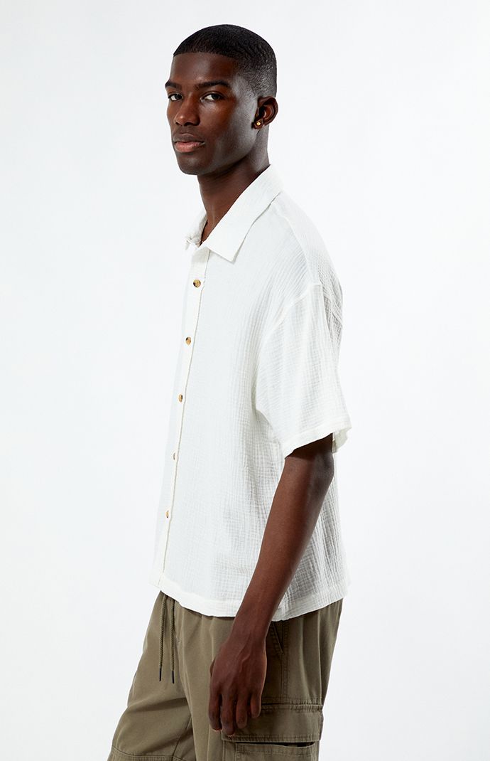 Whether you wear it for a special occasion or throw it on for a day at the skatepark, the Cream Boxy Button Down Shirt from PacSun is fashion-forward and can easily pair with the sick pieces in your closet. This button-down features a collared neckline, short sleeves, soft fabric, and a flattering fit. 


	Relaxed fit
	Short sleeves
	Collared neckline
	Button-down front closure
	PacSun branding
	100% Cotton
	Machine washable
	Model is wearing a size medium
	Model Measurements: 6'1”  Height, 34.5” Chest, 29" Waist Skate Park, The Cream, Model Measurements, Pacsun, Workout Shorts, Soft Fabric, Soft Fabrics, Fashion Forward, Button Downs