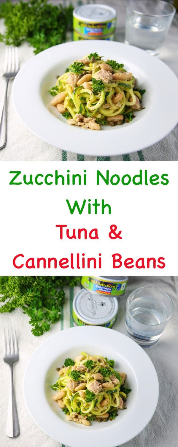 zucchini noodles with tuna and camellini beans in a white bowl on a table