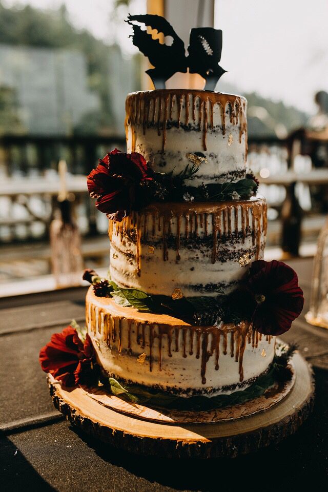 a three tiered cake sitting on top of a table