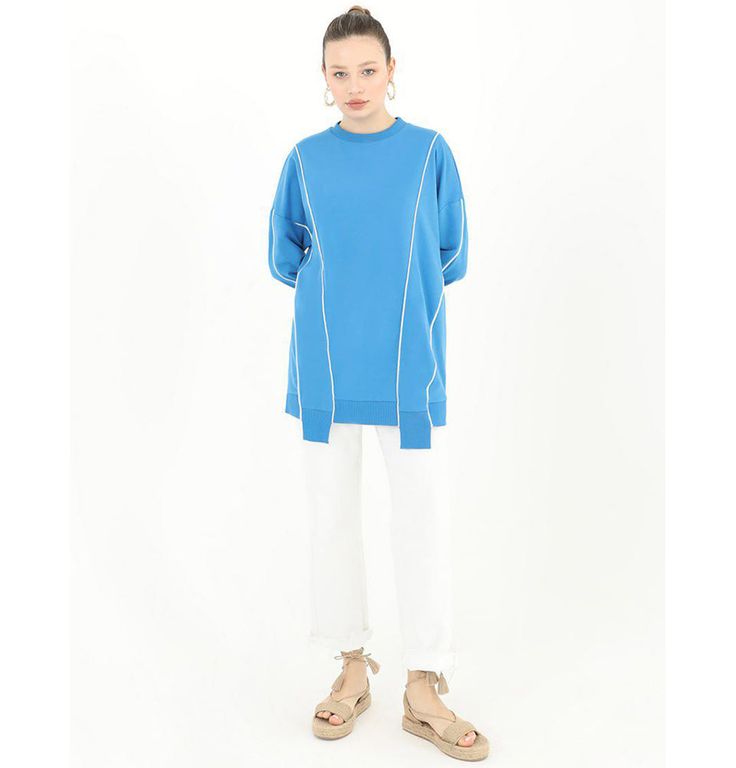 Modest Women's Sweater Tunic 10413 - BlueAn abstract sweater style tunic great for everyday wear! It has an asymmetrical cut, a loose fit, and white borderline design.FEATURES:- Sweater tunic- Asymmetrical lining- Drop shoulder sleevesMATERIAL:- 65% Cotton- 35% PolyesterCARE:- Machine wash at cold to warm temperatures- Do not tumble dry- Lay flat to dry- Do not bleach- Iron on lowMade in Turkey Modern Spring Sweater For Layering, Modern Long Sleeve Sweater For Spring, Casual Sweater With Asymmetrical Hem For Spring, Casual Spring Sweater With Asymmetrical Hem, Blue Casual Tunic With Relaxed Fit, Spring Crew Neck Relaxed Fit Tunic, Spring Crew Neck Tunic With Relaxed Fit, Casual Blue Tops With Asymmetrical Hem, Casual Blue Top With Asymmetrical Hem