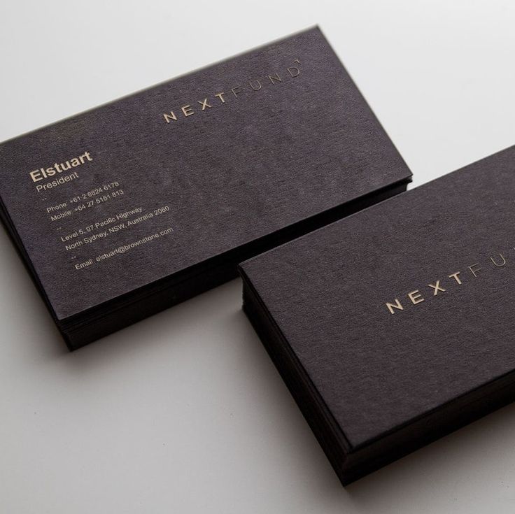 two black business cards sitting on top of each other