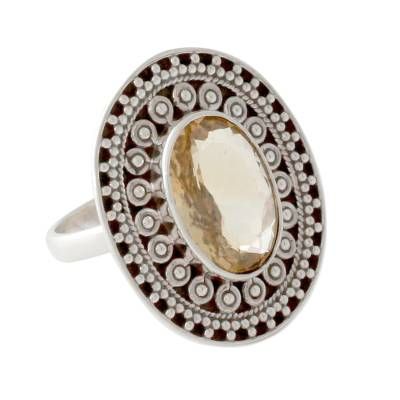 A halo of intricate silver surrounds an oval citrine like an aura. Crafted by hand the sterling motifs embrace a 5.5-carat stone. India's Neeru Goel designs this unforgettable cocktail ring. .925 Sterling silver