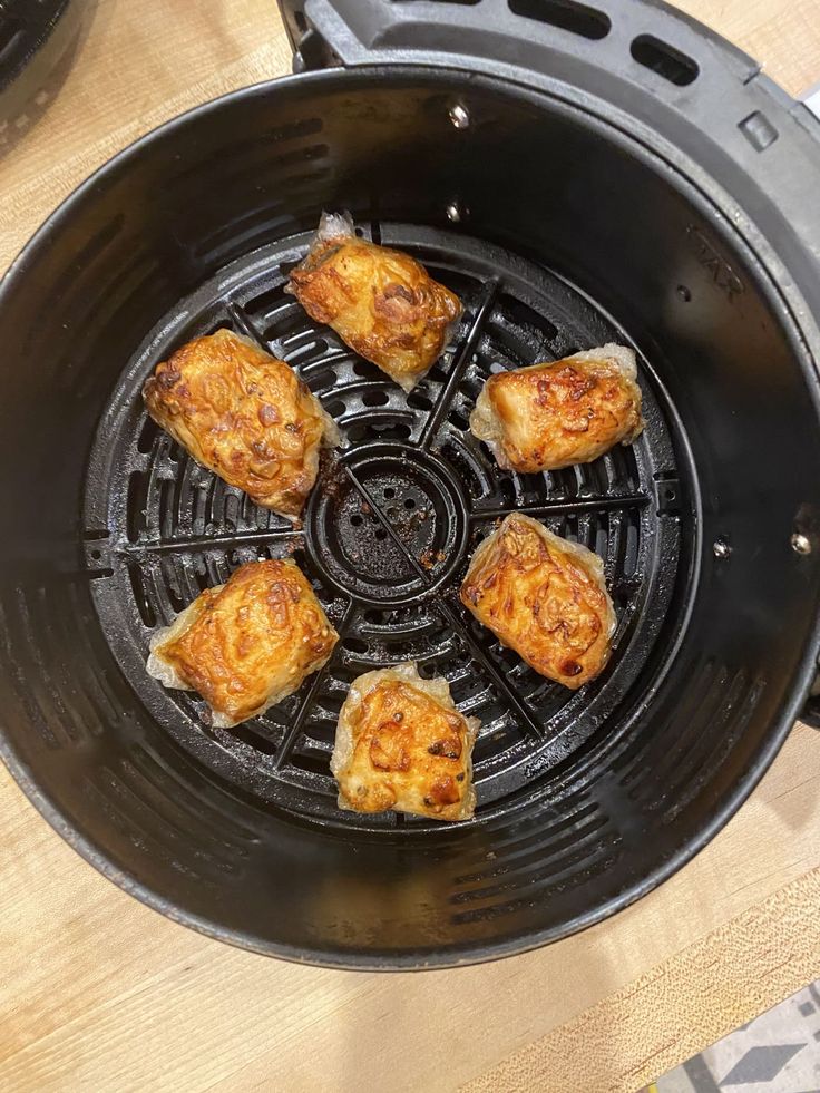 some food is cooking in an air fryer