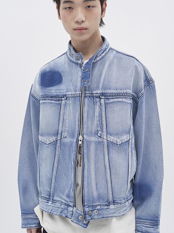 It is an oversized denim jacket with biker jacket design. The jacket is in light washed blue color with spot washed design. It has snap button tabs on the neck and hem and hidden chest pockets.- Two-way zipper closure- Snap buttons on the neck- Vertical seam point- Side pockets Denim Long Sleeve Biker Jacket For Streetwear, Streetwear Washed Blue Denim Jacket, Medium Wash Denim Jacket With Zipper For Streetwear, Denim Biker Jacket With Zipper For Streetwear, Denim Biker Jacket With Zipper Closure For Streetwear, Denim Jacket With Zipper Closure For Streetwear, Casual Denim Biker Jacket For Streetwear, Medium Wash Outerwear With Zipper For Streetwear, Medium Wash Outerwear With Zipper Closure For Streetwear