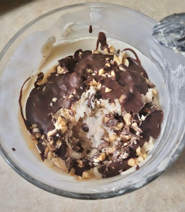 a bowl filled with ice cream and chocolate