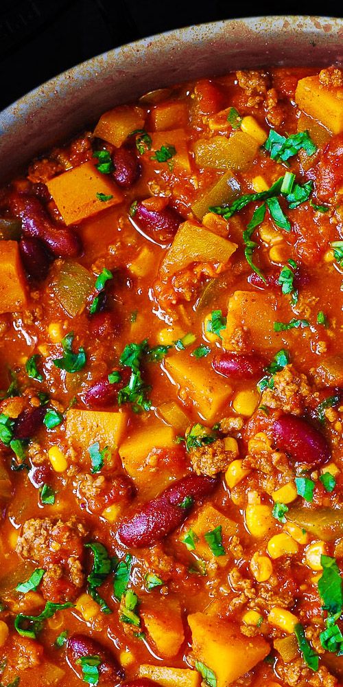 a large pot filled with chili and vegetables