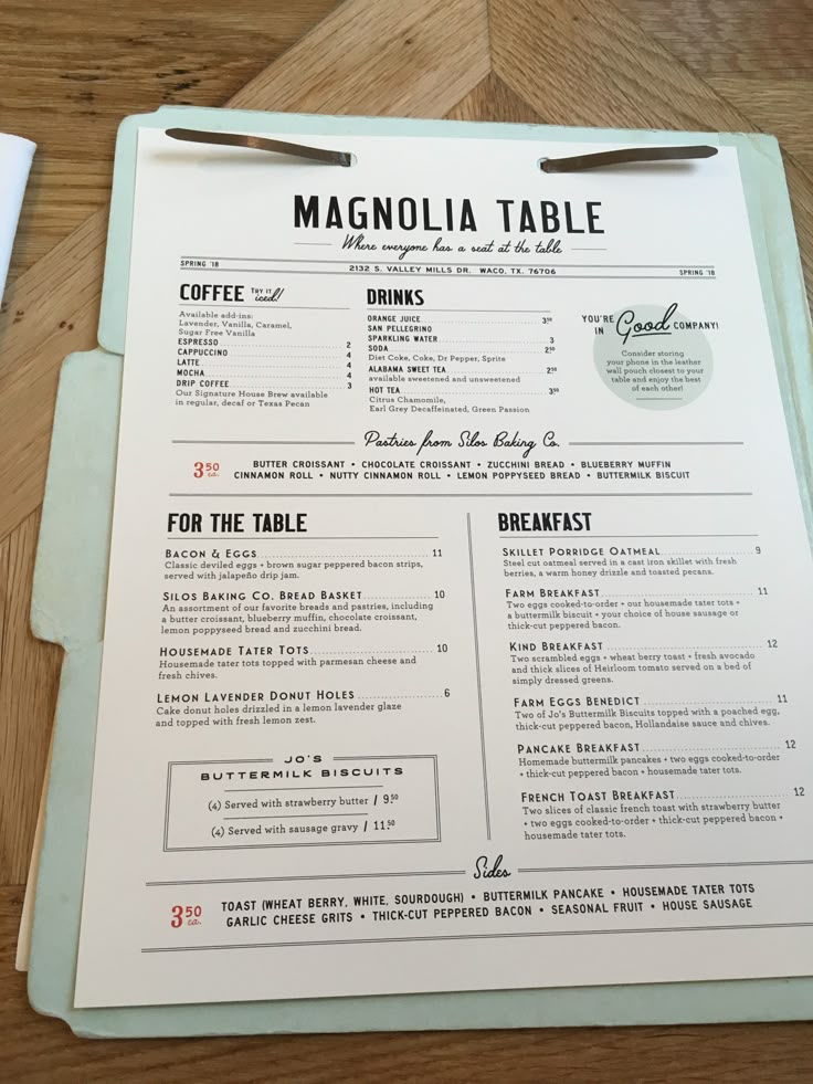 a menu sitting on top of a wooden table