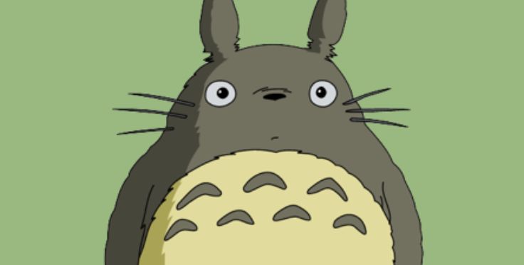 a totoro standing in front of a green background