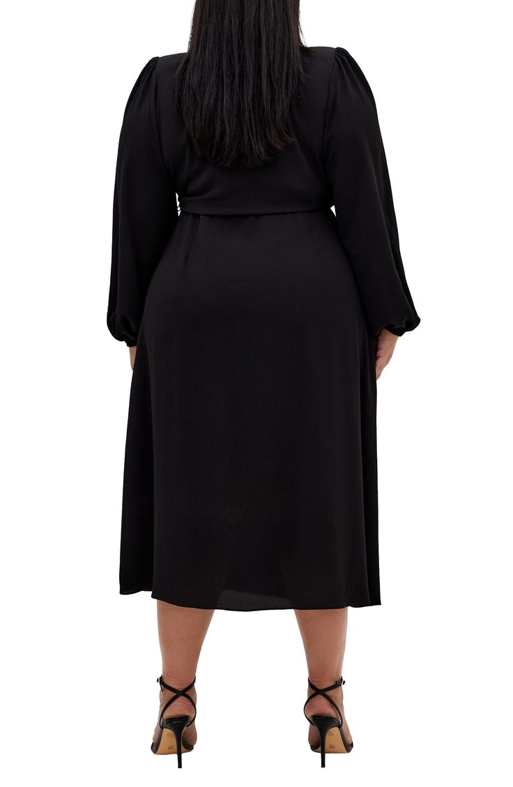 Keep your everyday look on point with this flowy wrap dress that's a versatile option for any occasion. True wrap style with side tie closure Spread collar Surplice V-neck Long sleeves with elastic cuffs Unlined 96% polyester, 4% elastane Machine wash, line dry Imported Black Wrap Dress With Surplice Neckline And Faux Wrap, Chic Black Faux Wrap Dress, Black Wrap Dress For Date Night, Black Wrap Dress With Surplice Neckline For Fall, Black Wrap Dress For Fall, Black Wrap Dress For Work, Black Wrap Dress With Tie Waist For Date Night, Black Tie Waist Wrap Dress For Date Night, Black Faux Wrap Dress For Spring