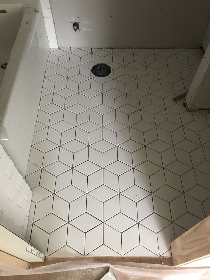 the bathroom floor is being remodeled with white tile