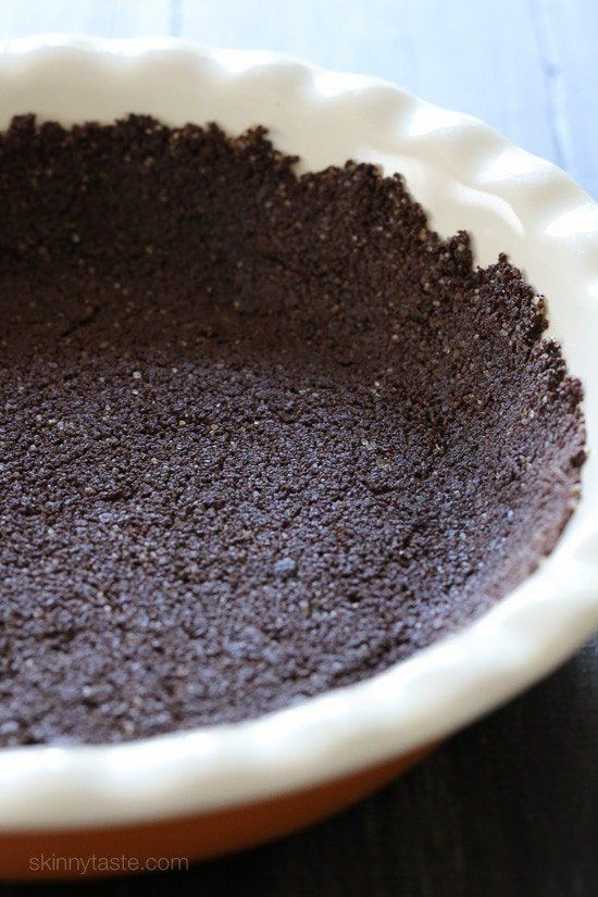 a pie pan filled with chocolate cake batter