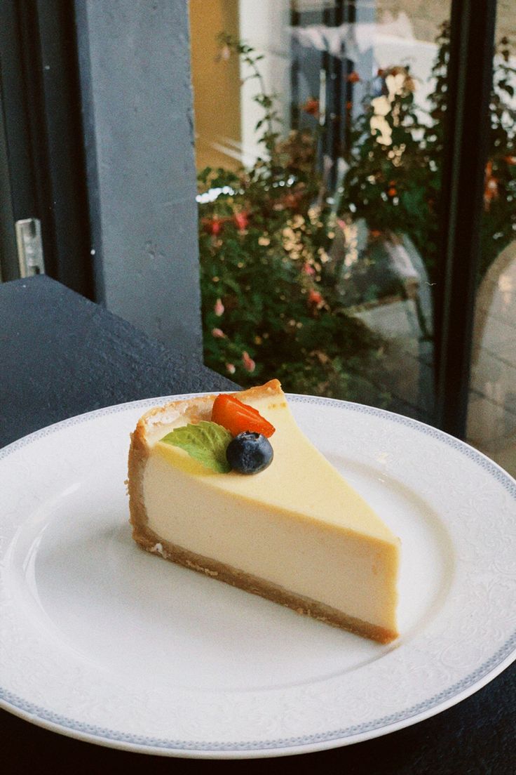 a slice of cheesecake on a white plate