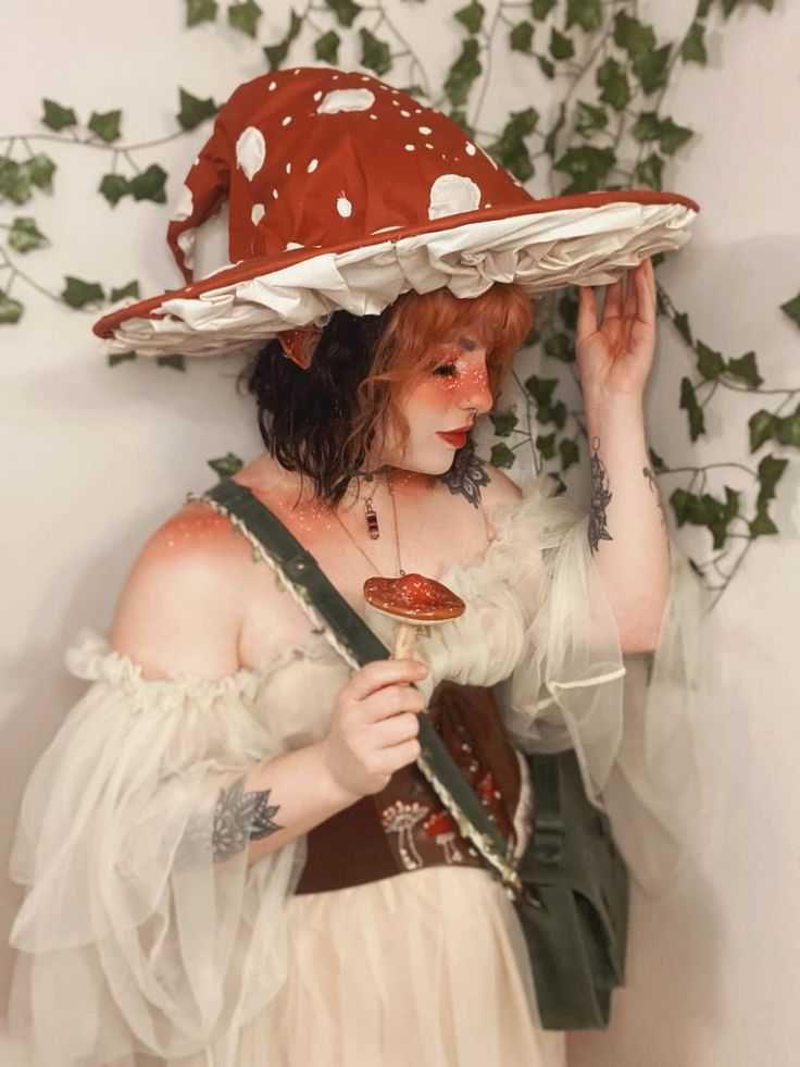 a woman wearing a red hat and holding a spoon