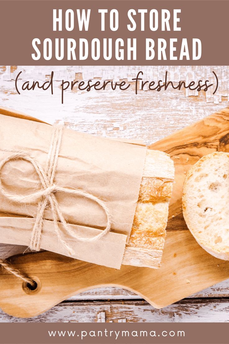 bread wrapped in brown paper on top of a wooden cutting board with the words how to store sourdough bread and preserve freshness