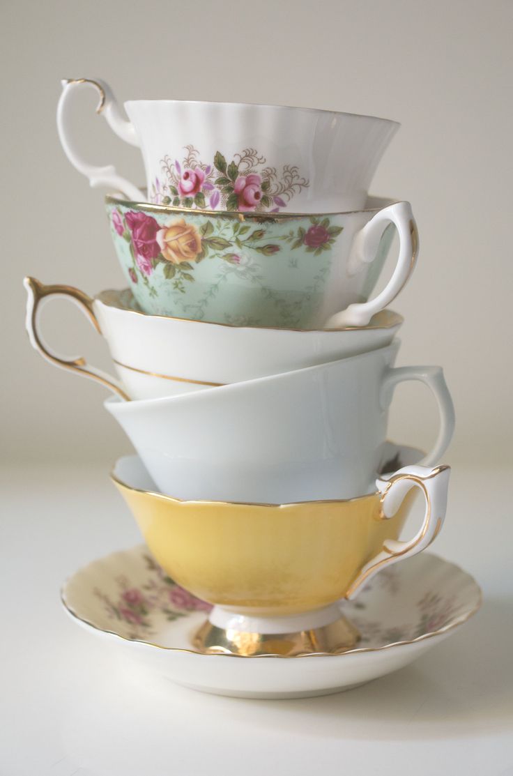 a stack of cups and saucers sitting on top of each other