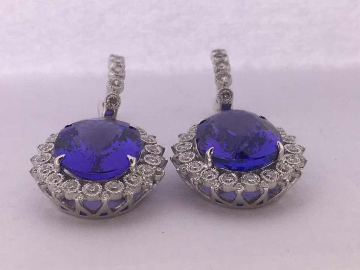 For Sale on 1stDibs - Natural Oval Tanzanite and Diamonds Earrings is set in 14K white Gold. Total weight of Tanzanite is 16.90 Carat and Total Diamond is 1.18 Carat. The earring Diamond Ball Earrings, Oval Tanzanite Earrings, Tanzanite Diamond Earrings, Oval Tanzanite Gemstone Earrings, Luxury Tanzanite Drop Earrings, Luxury Tanzanite Gemstone Earrings, Luxury Blue Tanzanite Earrings, Art Deco Drop Earrings, Emerald Diamond Earrings