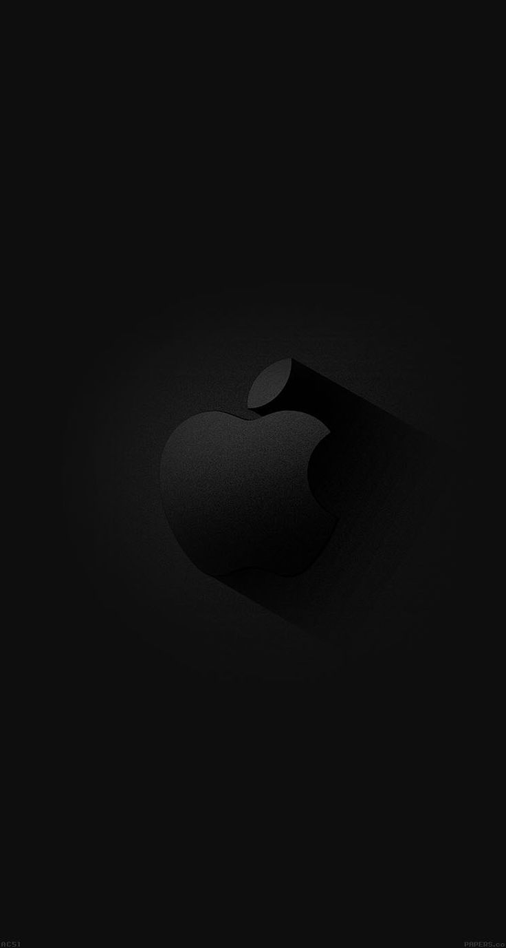 an apple logo is shown in the dark