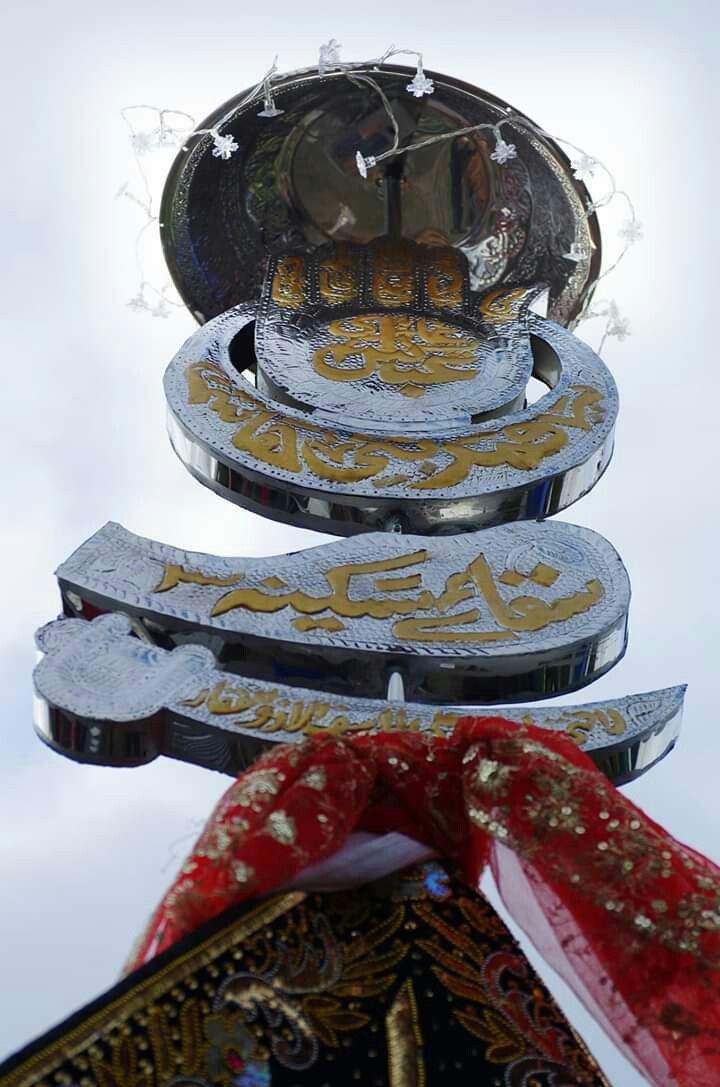 the top of a building with many signs on it