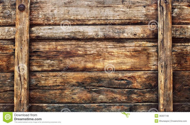 an old weathered wood wall with two wooden planks