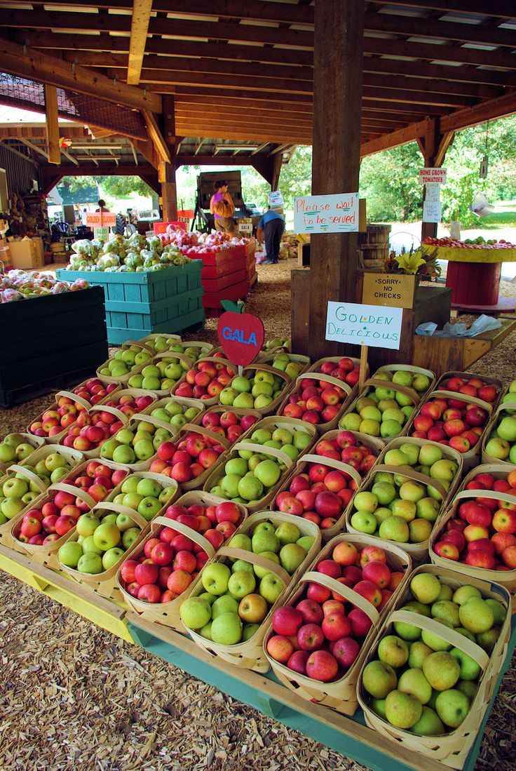 apples and pears for sale at an outdoor market